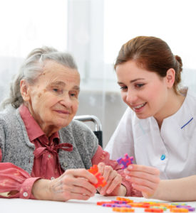 senior woman with her elder care nurse